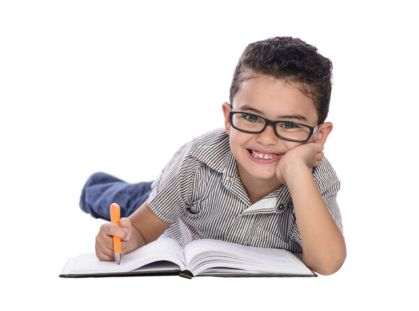 A child with a pencil and an open workbook.